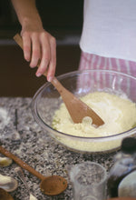 Load image into Gallery viewer, A hand carved spatula made using nz native timber mixing dry ingredients for baking.
