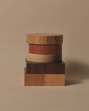 Load image into Gallery viewer, A stack of small end grain chopping boards in Swamp Kauri, Walnut, Oak, Tōtara, and Rimu