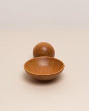 Load image into Gallery viewer, A hand carved spoon made of kauri on a white back ground, the spoon bowl is deep and round and the handle is a hand carved sphere.