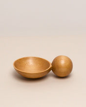 Load image into Gallery viewer, A hand carved spoon made of kauri on a white back ground, the spoon bowl is deep and round and the handle is a hand carved sphere.