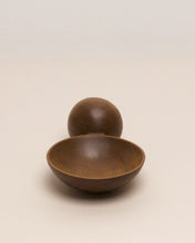 Load image into Gallery viewer, A hand carved spoon made of kauri on a white back ground, the spoon bowl is deep and round and the handle is a hand carved sphere.