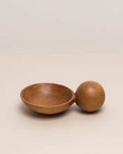 Load image into Gallery viewer, A hand carved spoon made of swamp kauri on a white back ground, the spoon bowl is deep and round and the handle is a hand carved sphere.