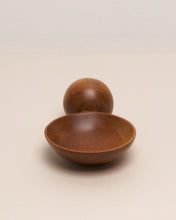 Load image into Gallery viewer, A hand carved spoon made of swamp kauri on a white back ground, the spoon bowl is deep and round and the handle is a hand carved sphere.