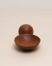 Load image into Gallery viewer, A hand carved spoon made of Tōtara on a white back ground, the spoon bowl is deep and round and the handle is a hand carved sphere.