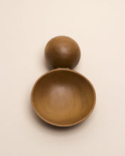 Load image into Gallery viewer, A hand carved spoon made of kauri on a white back ground, the spoon bowl is deep and round and the handle is a hand carved sphere.