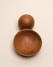 Load image into Gallery viewer, A hand carved spoon made of Tōtara on a white back ground, the spoon bowl is deep and round and the handle is a hand carved sphere.
