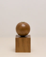 Load image into Gallery viewer, Hand-carved candle holder made from kauri wood, featuring a spherical base atop a square block.