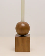 Load image into Gallery viewer, Hand-carved candle holder made from kauri wood, featuring a spherical base atop a square block.