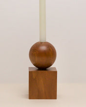 Load image into Gallery viewer, Hand-carved candle holder made from kauri wood, featuring a spherical base atop a square block.