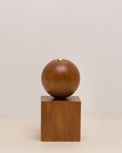Load image into Gallery viewer, Hand-carved candle holder made from kauri wood, featuring a spherical base atop a square block.