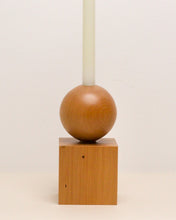 Load image into Gallery viewer, Hand-carved candle holder made from kauri wood, featuring a spherical base atop a square block.