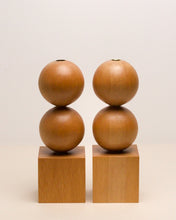 Load image into Gallery viewer, Hand-carved kauri candleholder from the Moon Series, featuring a double height spherical base atop a square block.
