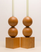 Load image into Gallery viewer, Hand-carved kauri candleholder from the Moon Series, featuring a double height spherical base atop a square block.