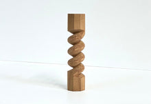Load image into Gallery viewer, A small wooden decorative sculpture with a twisted spiral design and hexagonal top and bottom, standing on a white surface against a white background.