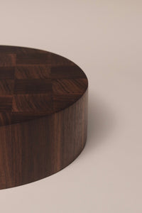 Handcrafted large round end grain chopping board made from high-quality Walnut, showcasing a durable and visually striking design.