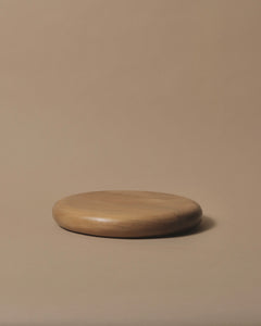 Round Swamp Kauri cheese or chopping board, smooth rounded edge.