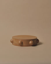 Load image into Gallery viewer, A round Kauri chopping or cheese board with 7 half spheres carved and placed equally around the outside edge