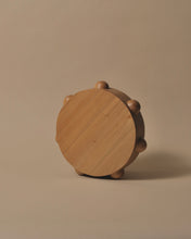 Load image into Gallery viewer, A round Kauri chopping or cheese board with 7 half spheres carved and placed equally around the outside edge