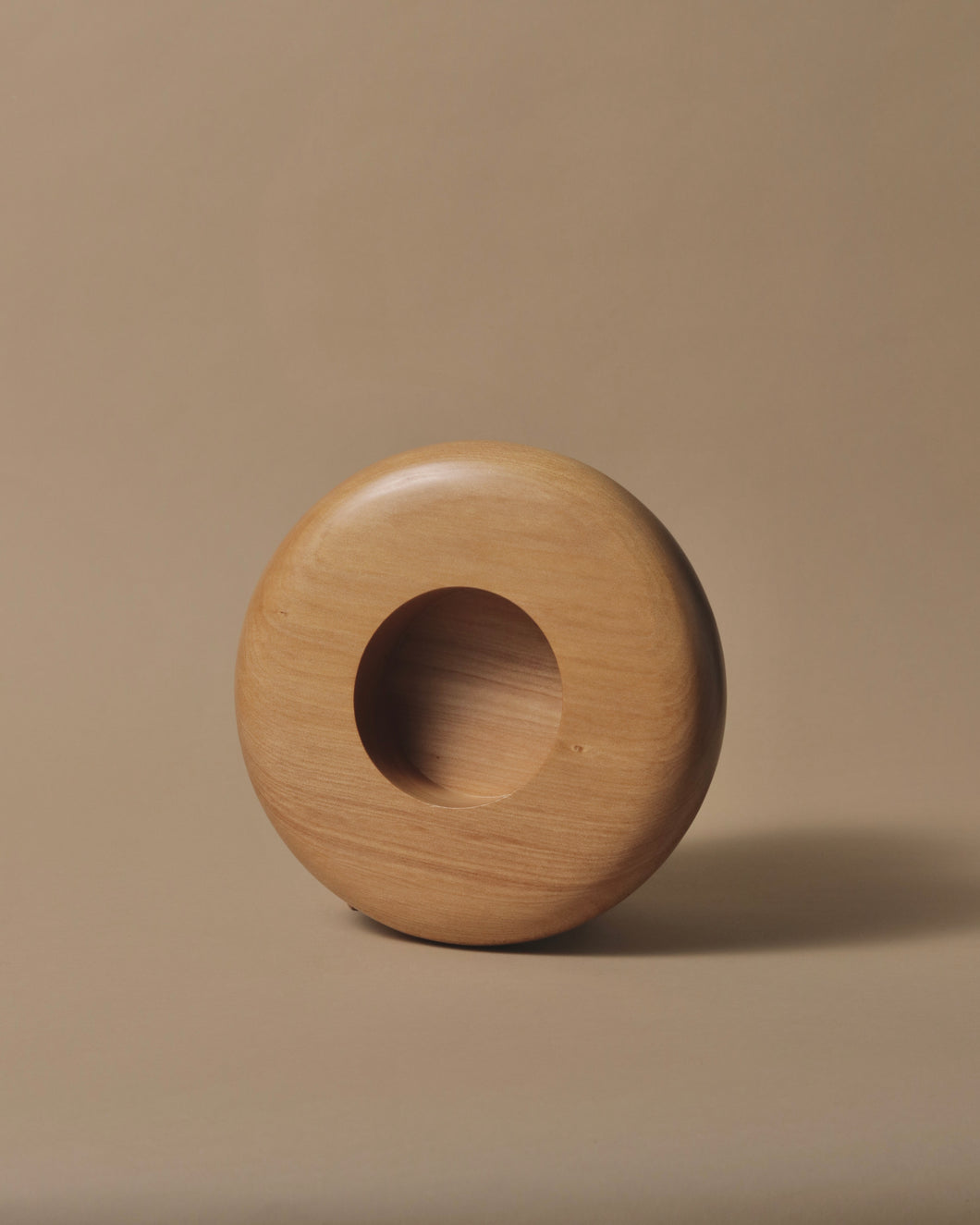 Round Kauri bowl with a soft rounded edde, a wide lip and a small bowl in the centre.