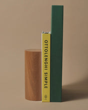 Load image into Gallery viewer, Handcrafted oak bookend holding two books, including &#39;Ottolenghi Simple,&#39; showcasing a minimalist and elegant design.