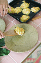 Load image into Gallery viewer, A hand carved wooden spatula serving made using native New Zealand timber a portion on food onto a plate on a kitchen bench.