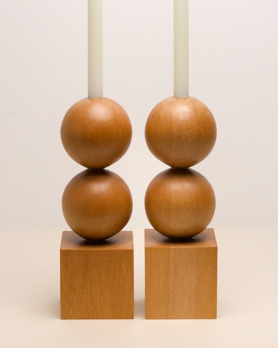Hand-carved kauri candleholder from the Moon Series, featuring a double height spherical base atop a square block.